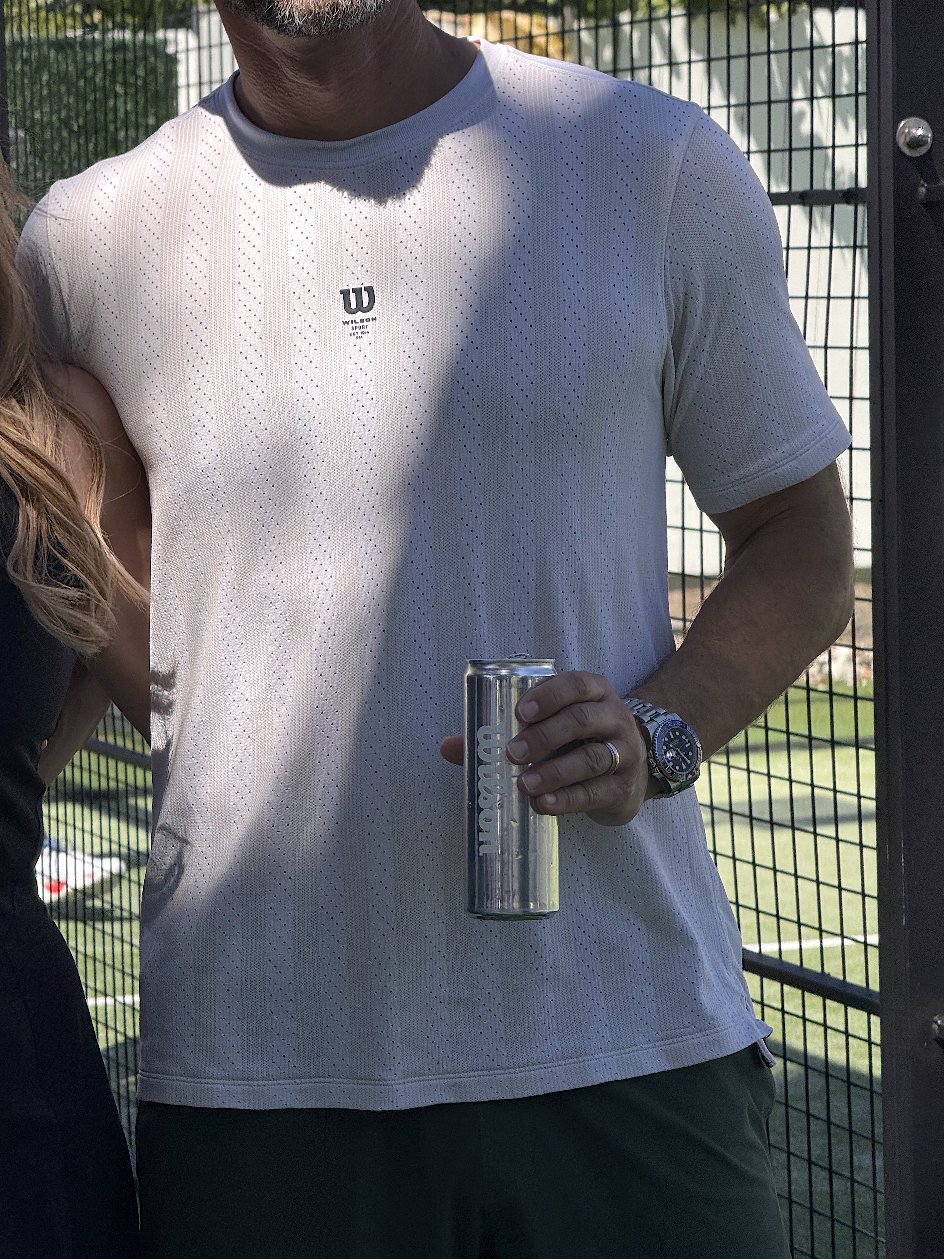 Wilson Tennis custom logo canned water — branded event drinks and conferences